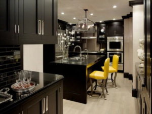 kitchens with black appliances and black countertops