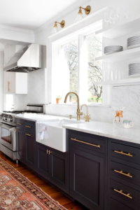 white cabinets with black stainless appliances